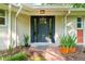 Inviting front entrance with dark gray door, brick pathway, and manicured landscaping at 2349 Echo Cliff Ne Ct, Atlanta, GA 30345
