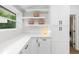Bright kitchen featuring open shelving, modern cabinetry, and stylish decor at 2349 Echo Cliff Ne Ct, Atlanta, GA 30345