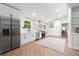 Spacious white kitchen featuring stainless steel appliances and ample cabinet space at 2349 Echo Cliff Ne Ct, Atlanta, GA 30345