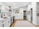 Updated kitchen with stainless steel appliances, floating shelves, and sleek cabinetry at 2349 Echo Cliff Ne Ct, Atlanta, GA 30345