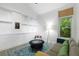 Bright living room with large window, comfortable seating, and built-in storage at 2349 Echo Cliff Ne Ct, Atlanta, GA 30345