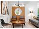 Stylish living room with modern lighting, a round mirror, and comfortable seating at 2349 Echo Cliff Ne Ct, Atlanta, GA 30345