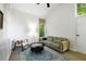 Bright living room with large window, comfortable seating, and view of white brick wall at 2349 Echo Cliff Ne Ct, Atlanta, GA 30345