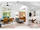 Spacious living room features bright interiors, ceiling fan, and open access to kitchen at 2349 Echo Cliff Ne Ct, Atlanta, GA 30345
