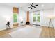 Open living room with vaulted ceiling, a modern fireplace, and large windows at 2349 Echo Cliff Ne Ct, Atlanta, GA 30345