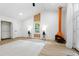 Spacious living room with an orange fireplace, wood floors, white brick walls, and a ceiling fan at 2349 Echo Cliff Ne Ct, Atlanta, GA 30345