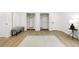 Bright, airy main bedroom with white brick walls, neutral paint, and an attached dressing room at 2349 Echo Cliff Ne Ct, Atlanta, GA 30345