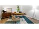 Well-lit office space featuring painted white brick walls, modern decor, and a large window at 2349 Echo Cliff Ne Ct, Atlanta, GA 30345