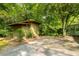 Backyard shed for extra storage, surrounded by lush trees and green space at 2349 Echo Cliff Ne Ct, Atlanta, GA 30345