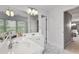 Elegant bathroom featuring double vanity, marble floors, and a bright, airy ambiance at 255 Wembley Cir, Atlanta, GA 30328