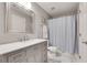 Charming bathroom featuring a vanity with marble countertop and a shower with patterned curtain at 255 Wembley Cir, Atlanta, GA 30328