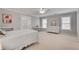 Bedroom featuring neutral walls, white trim, and a cozy ambiance with a ceiling fan at 255 Wembley Cir, Atlanta, GA 30328