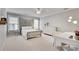 Bright bedroom with a decorative iron bed frame, white dresser, and a ceiling fan at 255 Wembley Cir, Atlanta, GA 30328