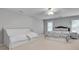 Bright bedroom with one queen bed and a daybed, featuring neutral walls and carpet at 255 Wembley Cir, Atlanta, GA 30328