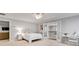 Light-filled bedroom with adjacent loft or sitting room accessible via French doors at 255 Wembley Cir, Atlanta, GA 30328