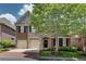 Beautifully designed home with a mix of brick, stone, and shaker siding, plus a well-kept lawn at 255 Wembley Cir, Atlanta, GA 30328