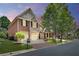 Charming two-story home with brick and stone exterior, a two-car garage, and a well-manicured lawn at 255 Wembley Cir, Atlanta, GA 30328