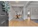 Elegant foyer featuring hardwood floors, neutral walls, and decorative table with open sight lines at 255 Wembley Cir, Atlanta, GA 30328