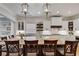 Bright kitchen featuring a large island, stylish pendant lighting, and white cabinetry at 255 Wembley Cir, Atlanta, GA 30328