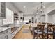 Large, bright kitchen with hardwood floors, eat-in island, window seating, and modern appliances at 255 Wembley Cir, Atlanta, GA 30328