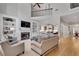 Open-concept living room offering a fireplace, built-in shelves, and access to the kitchen at 255 Wembley Cir, Atlanta, GA 30328