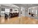 Open floor plan with kitchen island flowing into the living room with large windows at 255 Wembley Cir, Atlanta, GA 30328