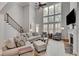 Bright living room with a fireplace, large windows, and comfortable seating at 255 Wembley Cir, Atlanta, GA 30328