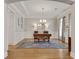 Well-lit office space with hardwood floors, decorative rug, and large window for natural light at 255 Wembley Cir, Atlanta, GA 30328