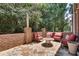 Cozy brick patio with flagstone flooring and a quaint seating area under string lights at 255 Wembley Cir, Atlanta, GA 30328
