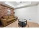 Finished basement with couch and table, great for recreation at 302 Shawnee Indian Ln, Suwanee, GA 30024