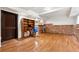 Finished basement with hardwood floors, brick accents, and bar area at 302 Shawnee Indian Ln, Suwanee, GA 30024