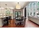 Eat-in kitchen area with breakfast bar, a round dining table, and lots of natural light at 302 Shawnee Indian Ln, Suwanee, GA 30024