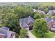 Two-story brick home with mature trees and a well-manicured lawn in a desirable neighborhood at 302 Shawnee Indian Ln, Suwanee, GA 30024