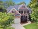 Beautiful brick home with lush landscaping and driveway at 302 Shawnee Indian Ln, Suwanee, GA 30024