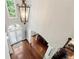 Grand two-story foyer with hardwood floors and elegant chandelier at 302 Shawnee Indian Ln, Suwanee, GA 30024