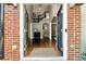Elegant foyer with hardwood floors, a grand staircase, and an arched entryway at 302 Shawnee Indian Ln, Suwanee, GA 30024