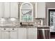 Modern kitchen with granite counters, stainless steel appliances, and white cabinets at 302 Shawnee Indian Ln, Suwanee, GA 30024