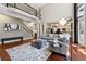 Bright living room with hardwood floors, high ceilings, and a cozy seating area at 302 Shawnee Indian Ln, Suwanee, GA 30024