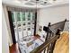 Bright living room with fireplace, built-ins, and a soaring wall of windows with backyard views at 302 Shawnee Indian Ln, Suwanee, GA 30024