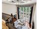 Open concept living room with large windows and vaulted ceiling from an upstairs vantage point at 302 Shawnee Indian Ln, Suwanee, GA 30024