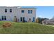Backyard view showing a lawn, patio, and exterior of the home, highlighting the outdoor living space at 332 Heavenly Hollow Pl, Mcdonough, GA 30253