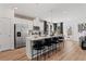 Contemporary kitchen with white cabinets, stainless appliances, and an island with bar stool seating at 332 Heavenly Hollow Pl, Mcdonough, GA 30253