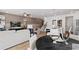 Inviting living room and dining area showcasing modern decor, wood floors and plenty of natural light at 332 Heavenly Hollow Pl, Mcdonough, GA 30253