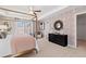 Bright bedroom featuring a four-poster bed, neutral decor, and a serene atmosphere with ample natural light at 332 Heavenly Hollow Pl, Mcdonough, GA 30253