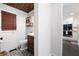 Powder room featuring dark vanity, accent wall, and designer tile floors at 3600 Morishop Nw Cv, Marietta, GA 30064
