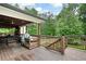 Spacious outdoor deck with cooking area and wooded views at 3600 Morishop Nw Cv, Marietta, GA 30064