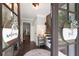 Inviting entryway featuring hardwood floors, stylish decor, and a staircase at 3600 Morishop Nw Cv, Marietta, GA 30064