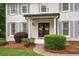 Charming white brick home with gray shutters and professionally landscaped front yard at 3600 Morishop Nw Cv, Marietta, GA 30064