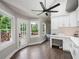 Eat-in kitchen area featuring hardwood floors and access to outdoor deck at 3600 Morishop Nw Cv, Marietta, GA 30064