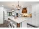 Modern kitchen with white cabinets, stainless steel appliances, and a large island at 3600 Morishop Nw Cv, Marietta, GA 30064